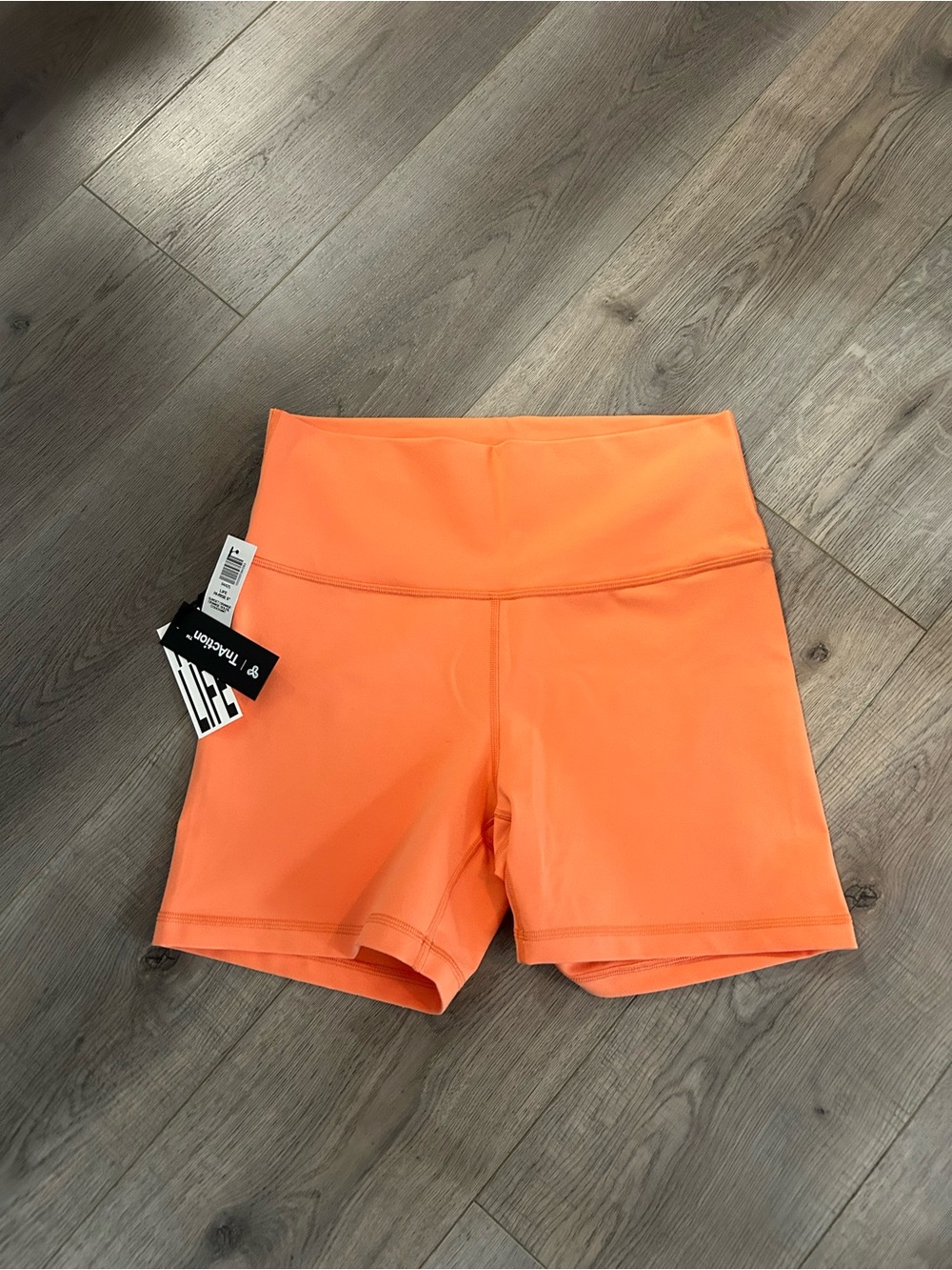 TNA Hi-Rise 5” TnAction Shorts in Sunset Orange